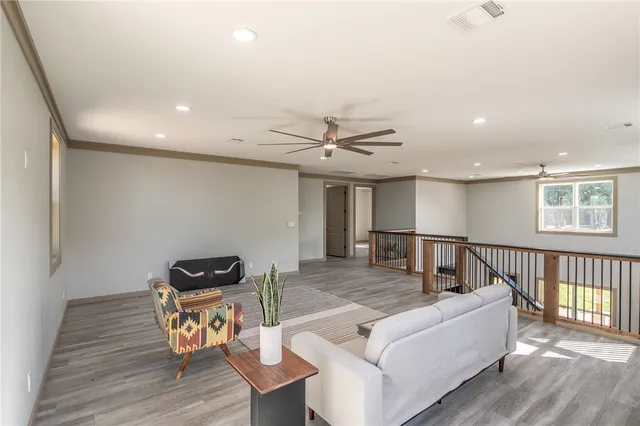 a bathroom with a toilet a sink and shower