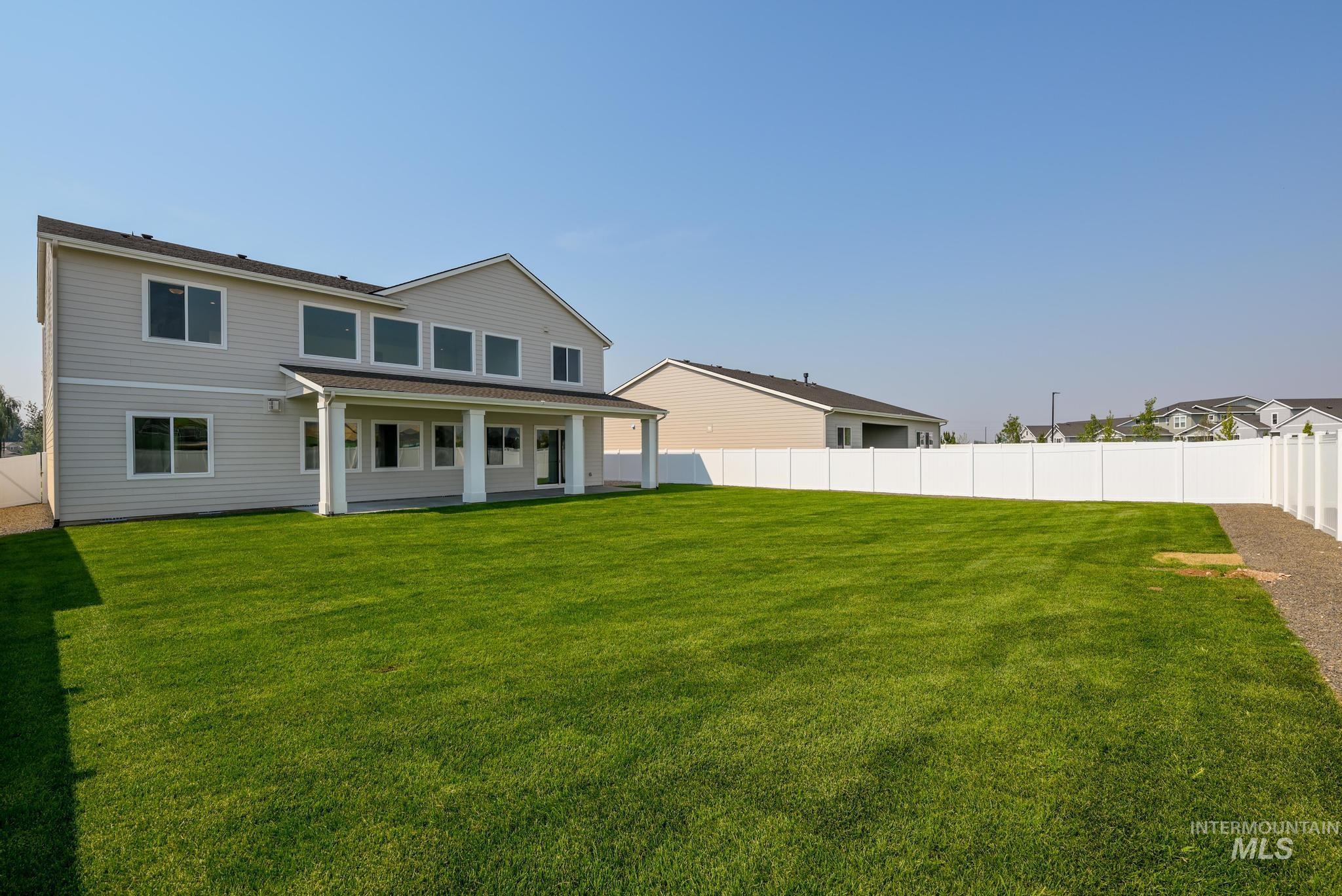 5431 North Ebony Way Meridian, ID 83646 - Photo 13 of 13 Rear view of house featuring a fenced backyard and a patio
