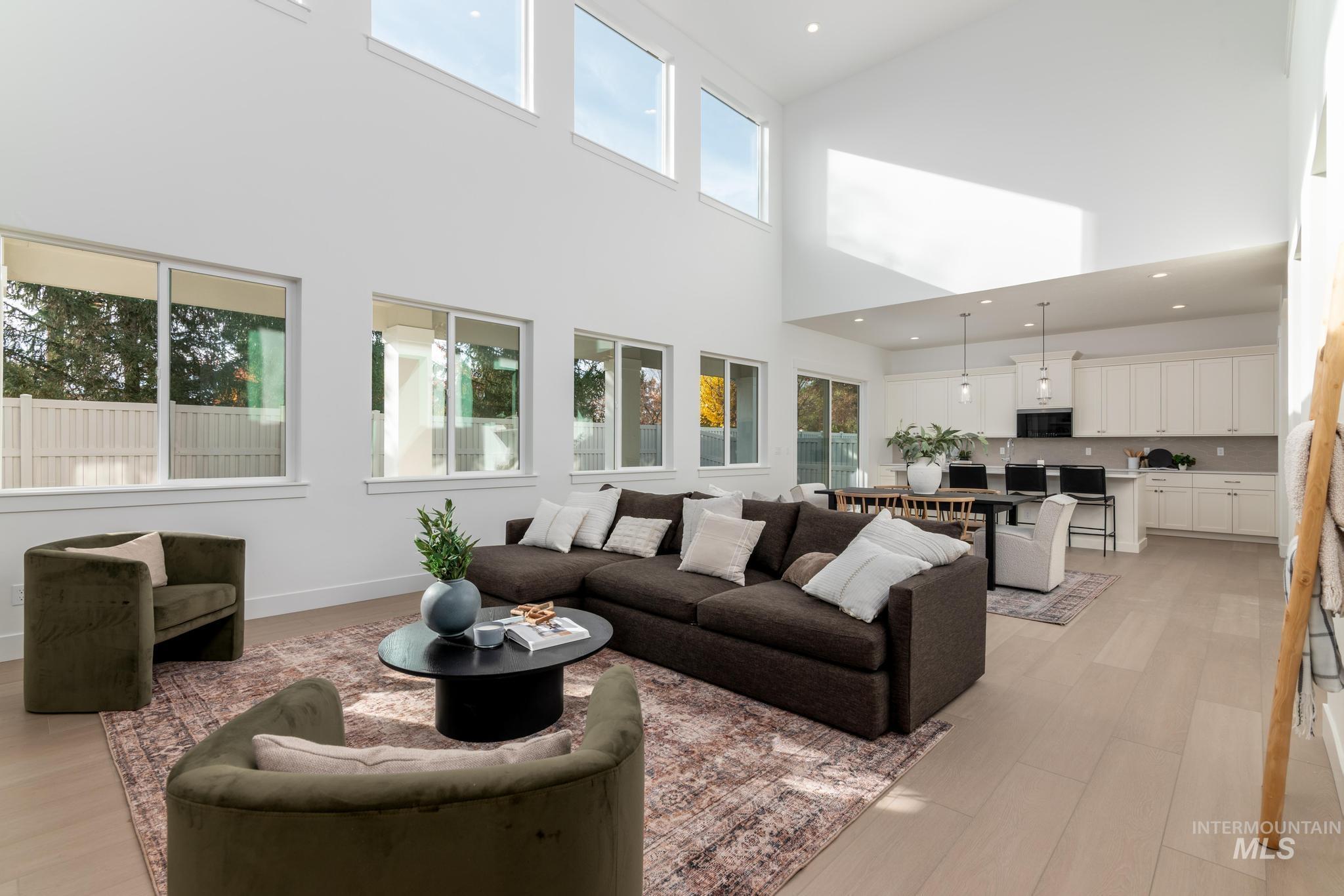 5431 North Ebony Way Meridian, ID 83646 - Photo 4 of 13 Living area featuring recessed lighting, light wood finished floors, and a high ceiling