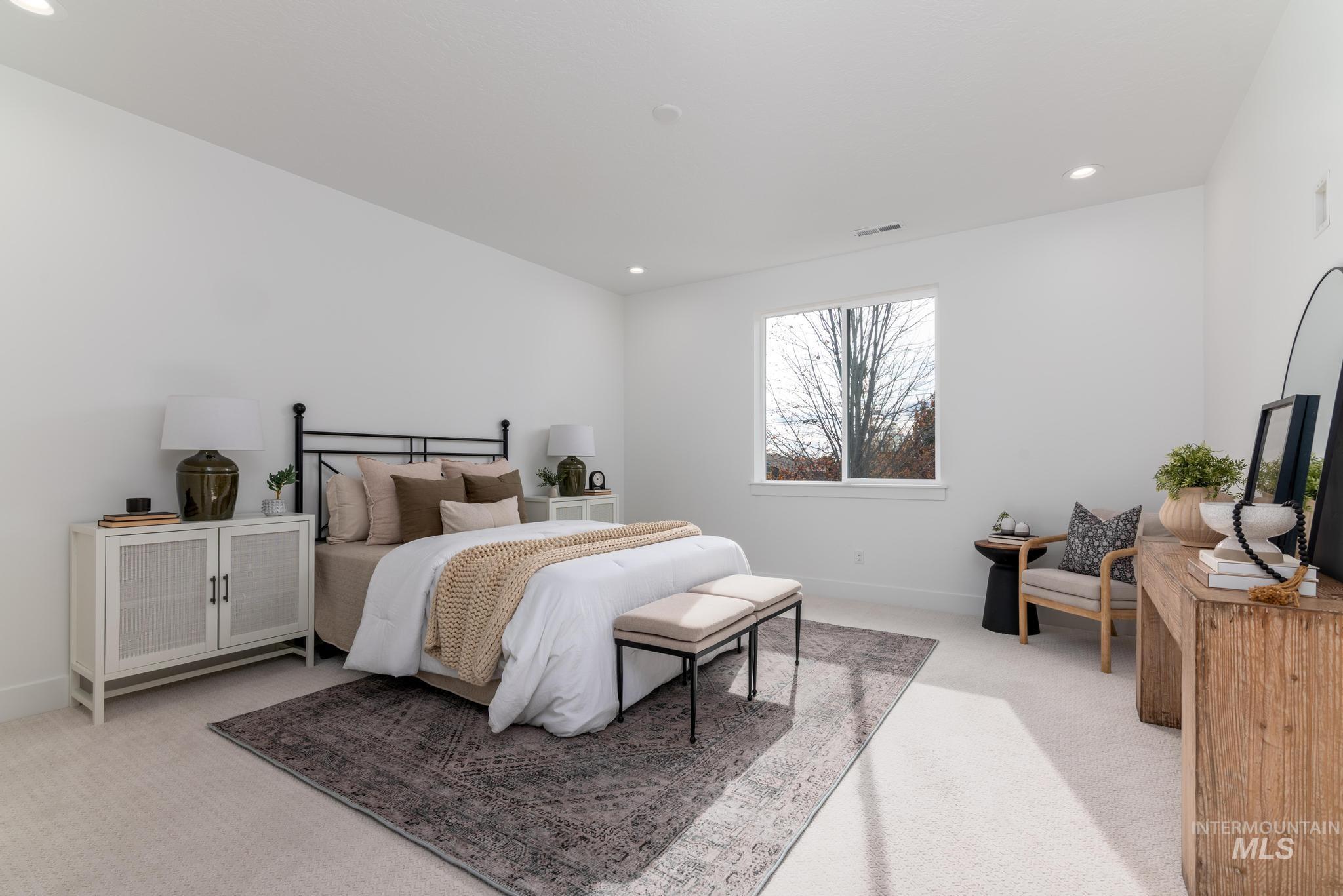 5431 North Ebony Way Meridian, ID 83646 - Photo 8 of 13 Bedroom featuring light carpet and recessed lighting