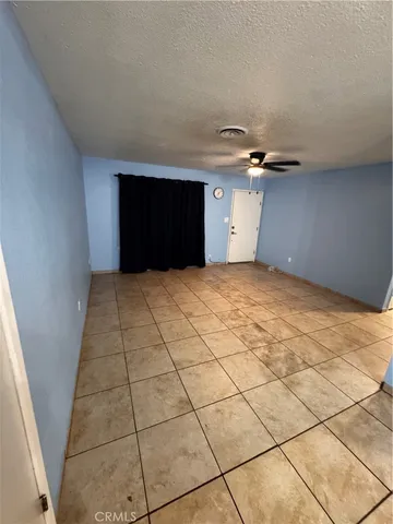 a view of an empty room with a fireplace