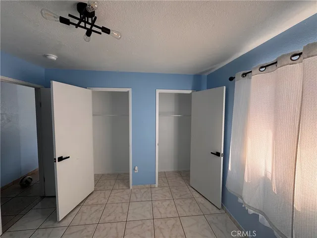 a view of a hallway with closet area