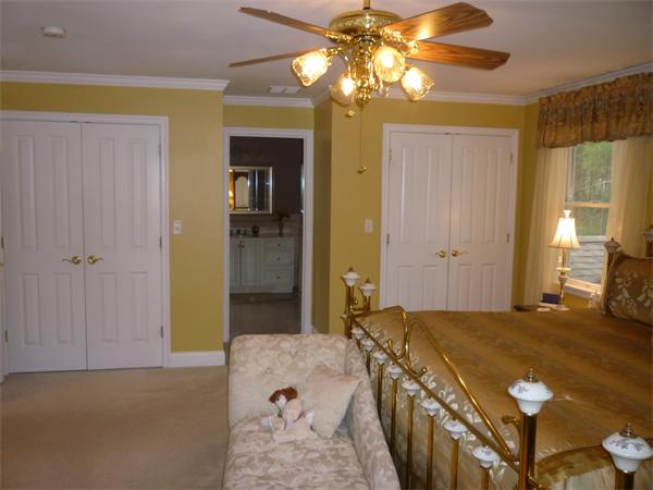 218 Rangeway Road, Unit 271 Billerica, MA 01862 - Photo 17 of 30 a bedroom with a bed and a chandelier