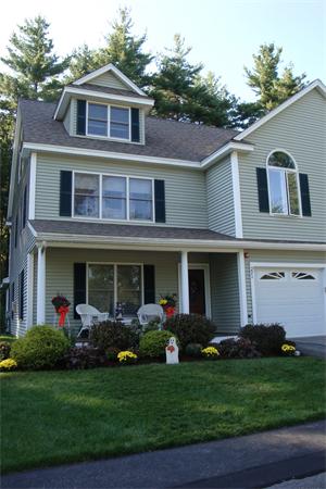 218 Rangeway Road, Unit 271 Billerica, MA 01862 - Photo 2 of 30 a front view of a house with a garden