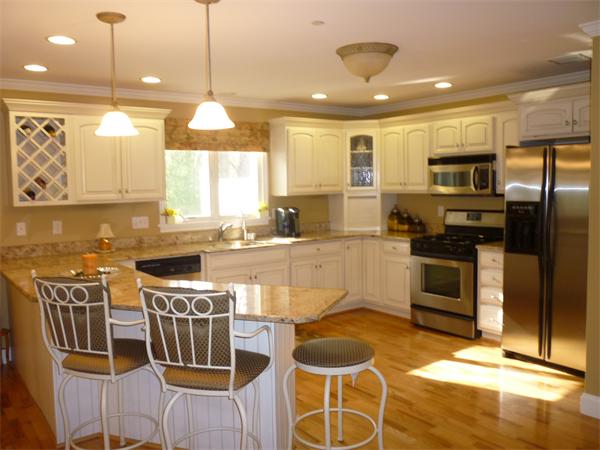 218 Rangeway Road, Unit 271 Billerica, MA 01862 - Photo 6 of 30 a kitchen with stainless steel appliances granite countertop a stove a sink and a microwave