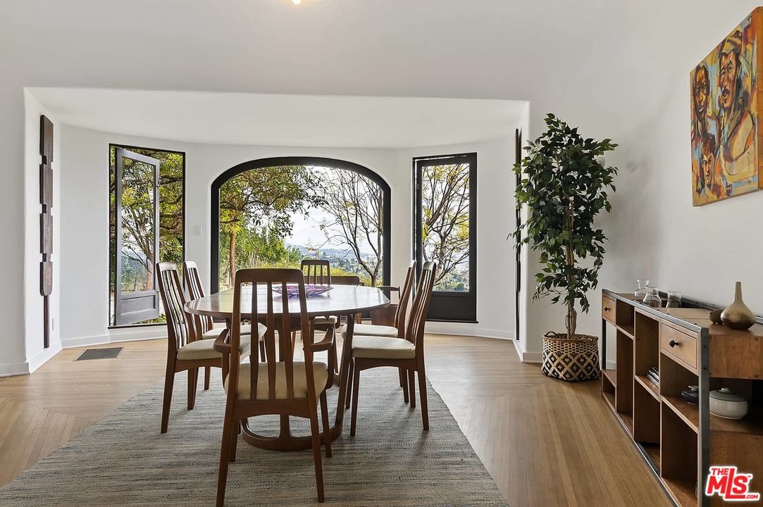8142 Laurel View Drive Los Angeles, CA 90069 - Photo 13 of 41 a view of a livingroom with furniture window and wooden floor