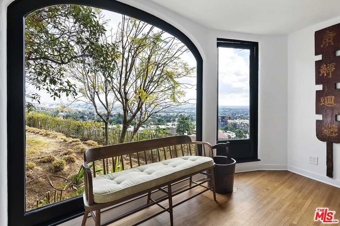 8142 Laurel View Drive Los Angeles, CA 90069 - Photo 15 of 41 a view of a wooden bench sitting in front of a house