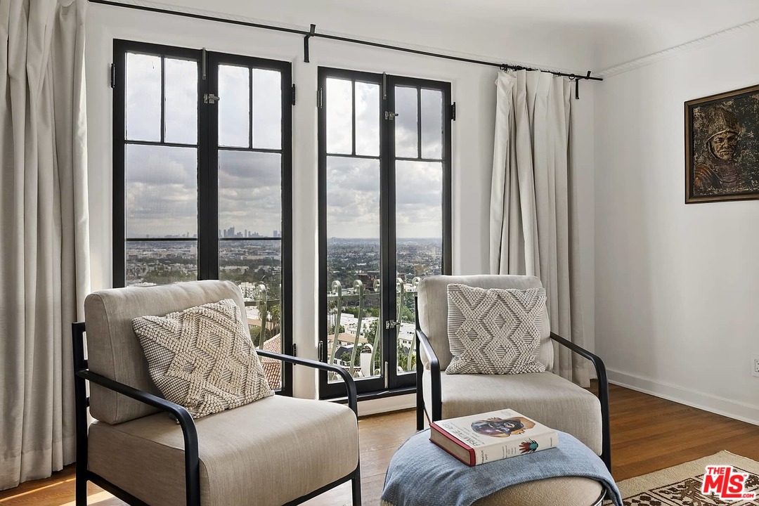 8142 Laurel View Drive Los Angeles, CA 90069 - Photo 27 of 41 a living room with furniture and a large window