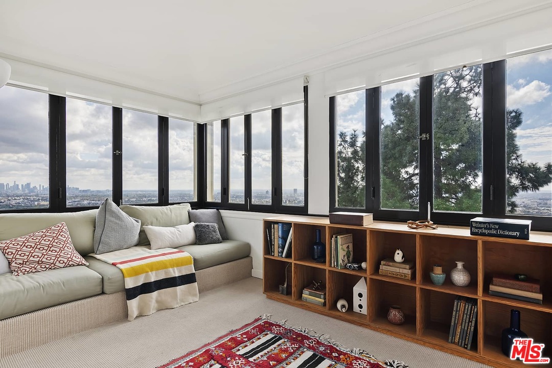 8142 Laurel View Drive Los Angeles, CA 90069 - Photo 29 of 41 a living room with furniture and a large window