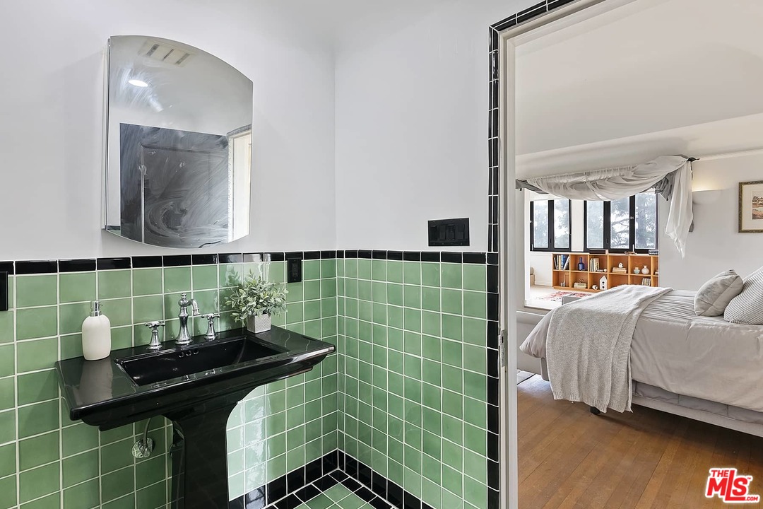 8142 Laurel View Drive Los Angeles, CA 90069 - Photo 32 of 41 a bathroom with a sink a toilet and shower