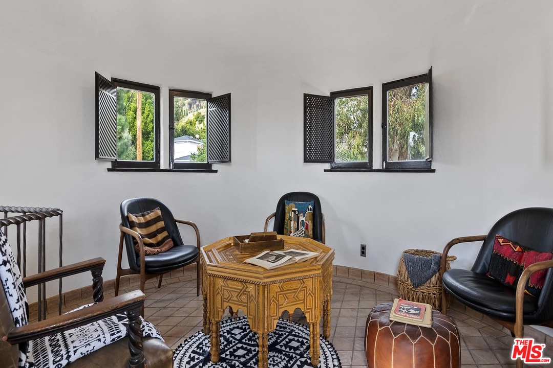 8142 Laurel View Drive Los Angeles, CA 90069 - Photo 37 of 41 a view of a workspace with furniture and lounge chair