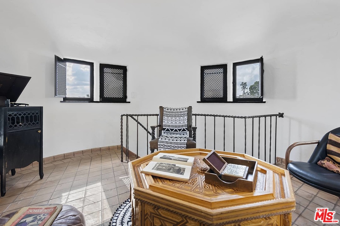 8142 Laurel View Drive Los Angeles, CA 90069 - Photo 38 of 41 a bedroom with furniture and a window