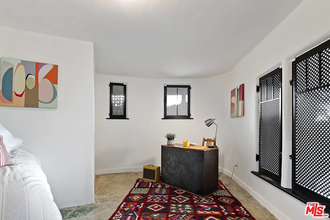 8142 Laurel View Drive Los Angeles, CA 90069 - Photo 41 of 41 a bed room with a bed and a window