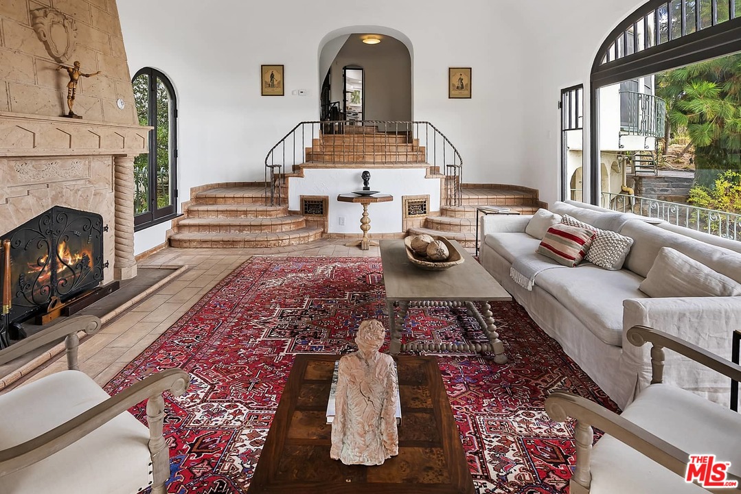 8142 Laurel View Drive Los Angeles, CA 90069 - Photo 9 of 41 a living room with furniture and a fireplace