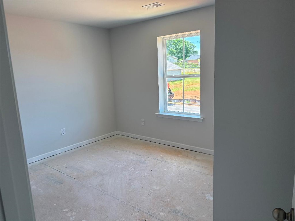 129 Cedar Shoals Easley, SC 29640 - Photo 22 of 31 A well-lit room awaits your personal touch, offering views of the surrounding neighborhood.