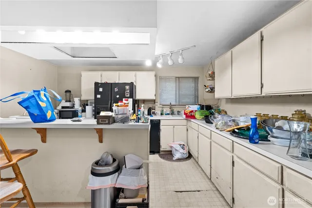 a kitchen with a sink and cabinets