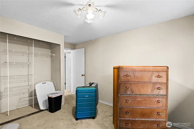 a view of room with hardwood floor and window