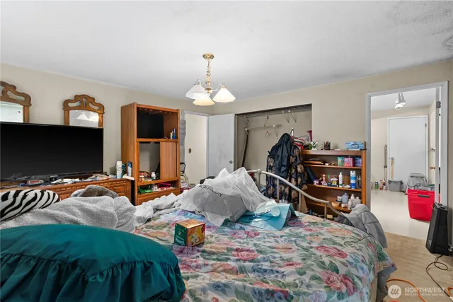 a room with furniture a mirror and a wooden floor