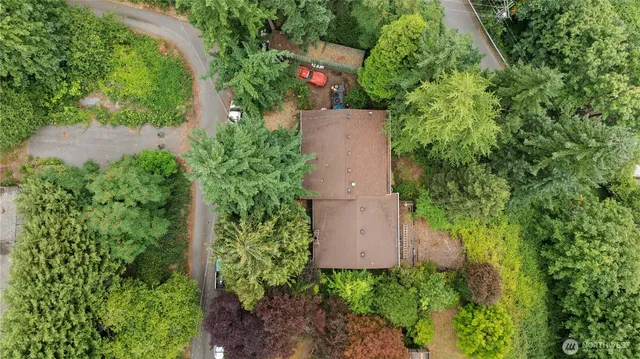 a view of a house with a chairs in a patio