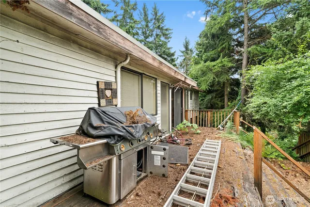 a balcony with wooden floor and fence