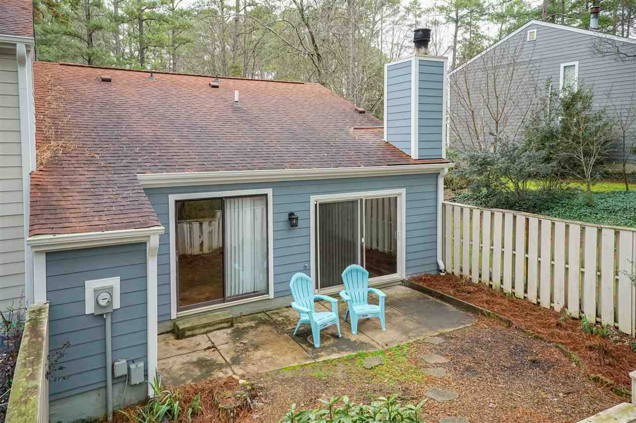 1010 Bend Drive Raleigh, NC 27609 - Photo 20 of 24 Soak in the sun in your privately fenced back patio. Enjoy a cocktail and invite your new neighbors over for a meet and greet! Exterior Back