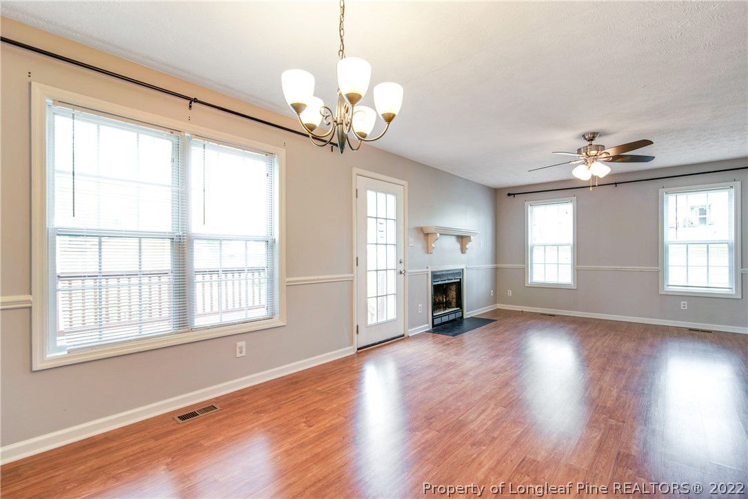 205 Rye Lane Raeford, NC 28376 - Photo 13 of 38 a view of an empty room with wooden floor and a window