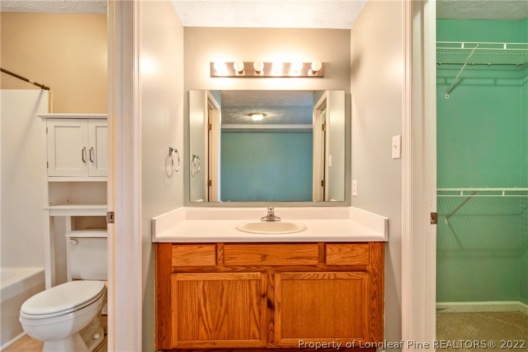 205 Rye Lane Raeford, NC 28376 - Photo 23 of 38 a bathroom with a sink and a mirror