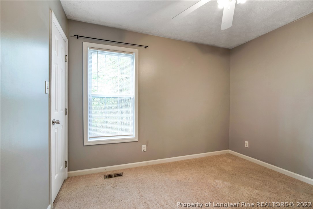 205 Rye Lane Raeford, NC 28376 - Photo 28 of 38 an empty room with windows