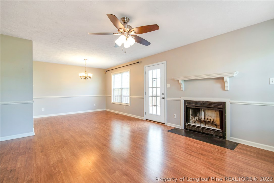 205 Rye Lane Raeford, NC 28376 - Photo 7 of 38 a view of an empty room with wooden floor and a window