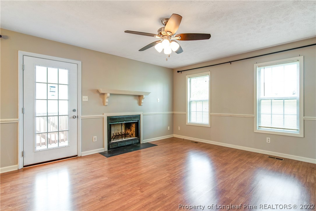 205 Rye Lane Raeford, NC 28376 - Photo 8 of 38 a view of an empty room with wooden floor and a window