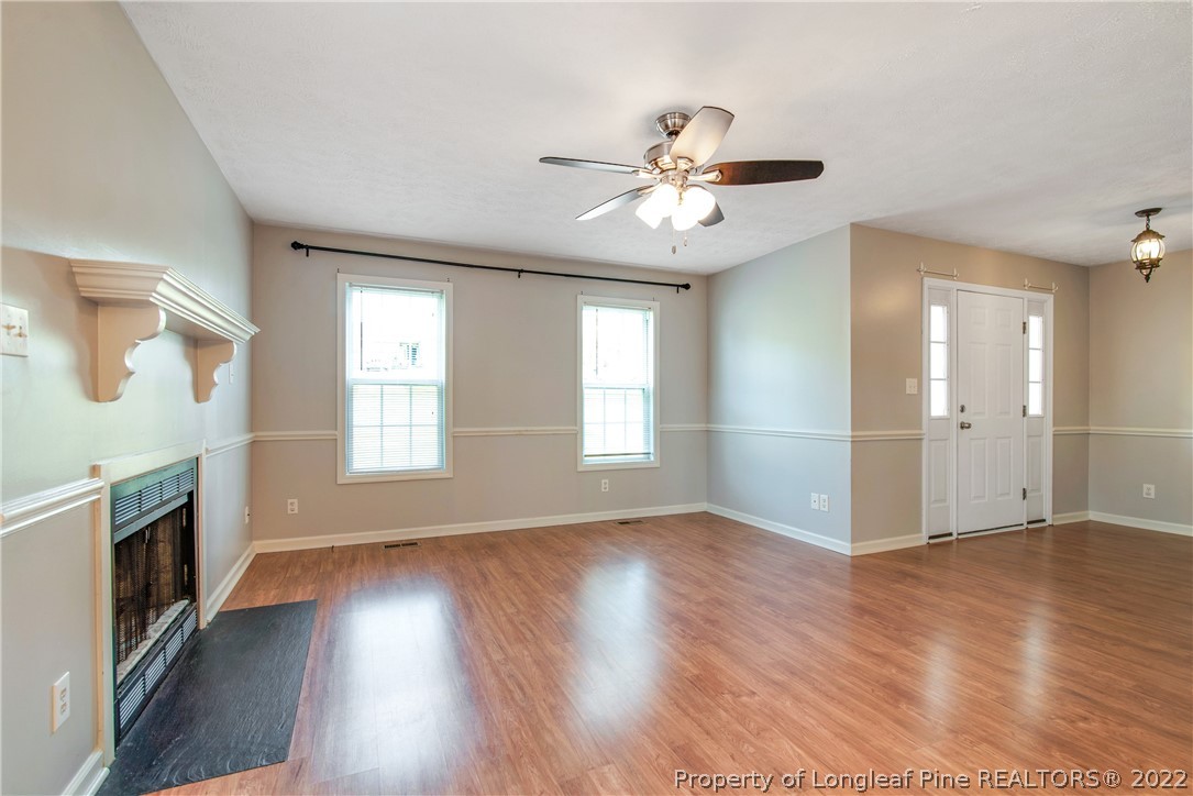 205 Rye Lane Raeford, NC 28376 - Photo 10 of 38 a view of an empty room with wooden floor and a window