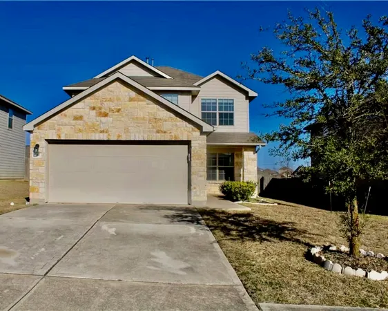 a view of house with yard