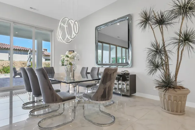 a view of a backyard with plants and lake view