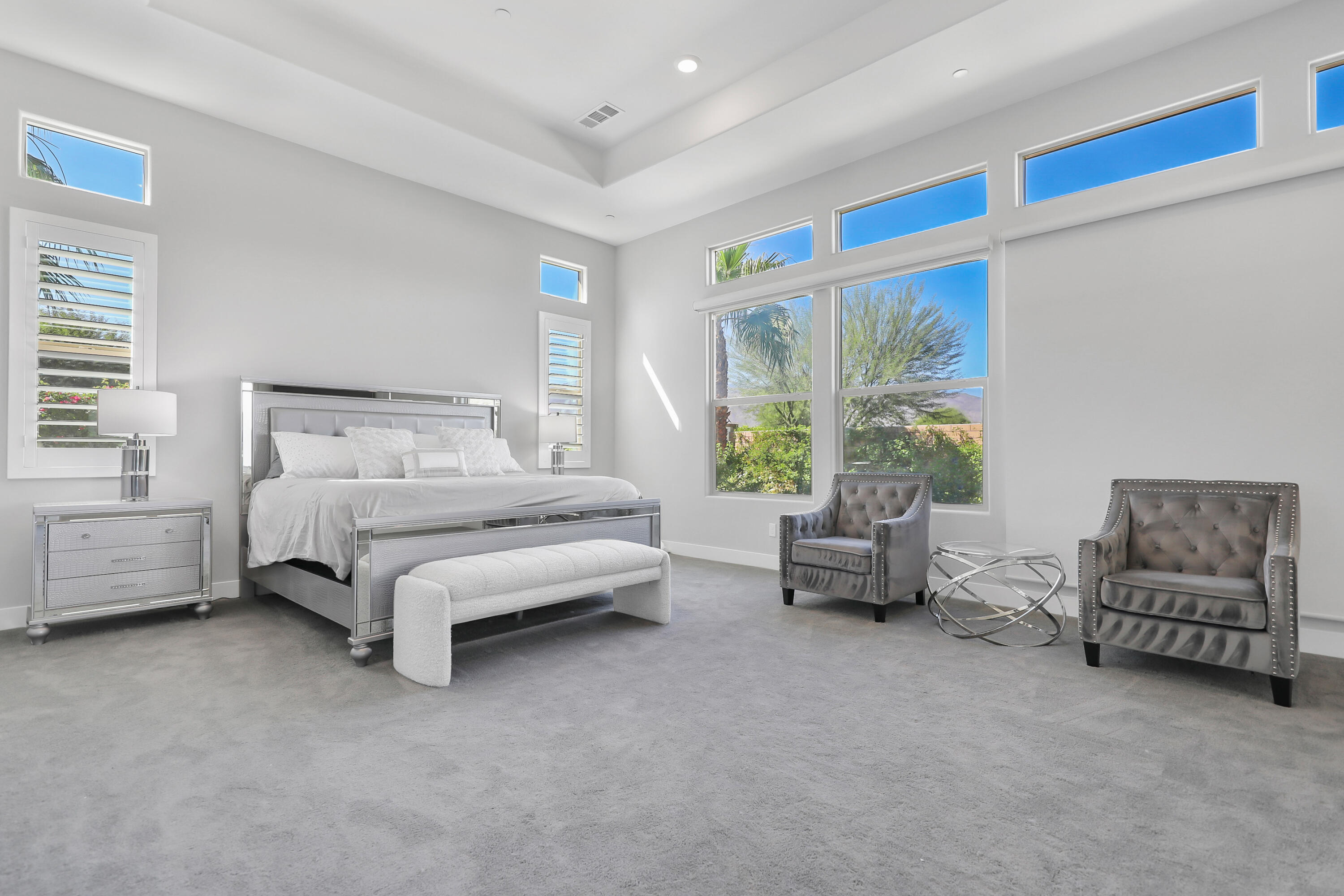 81-695 Thunder Gulch Way La Quinta, CA 92253 - Photo 12 of 51 a bedroom with furniture and a large window