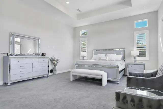 a view of a backyard with plants and a patio