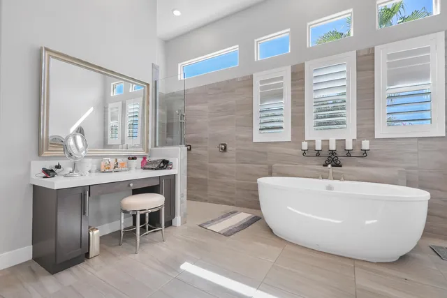 a view of a house with a yard patio and fire pit