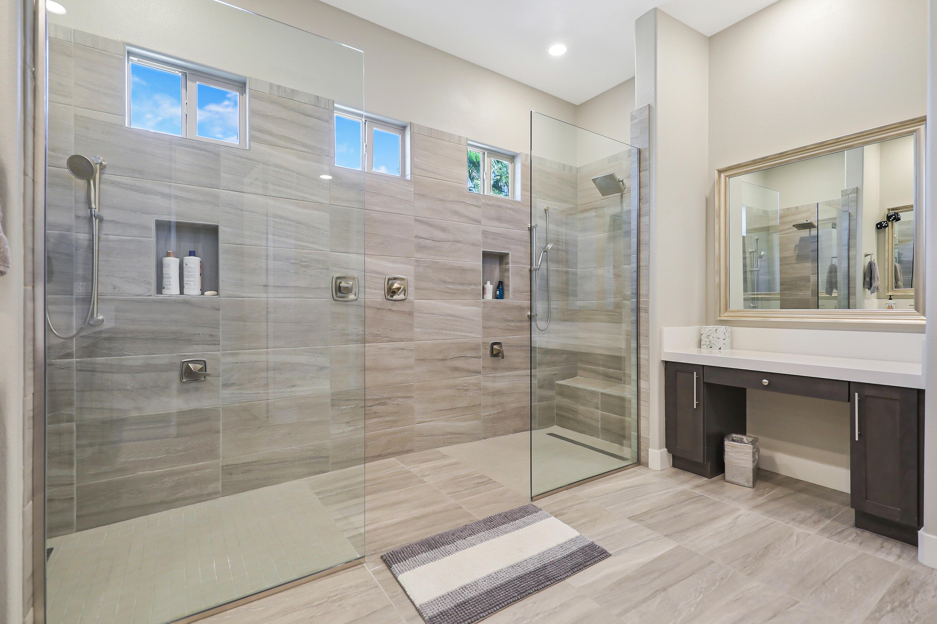 81-695 Thunder Gulch Way La Quinta, CA 92253 - Photo 30 of 51 a bathroom with a glass door shower and a sink