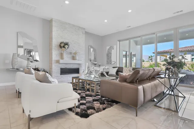 a kitchen with kitchen island granite countertop a sink counter top space appliances and cabinets