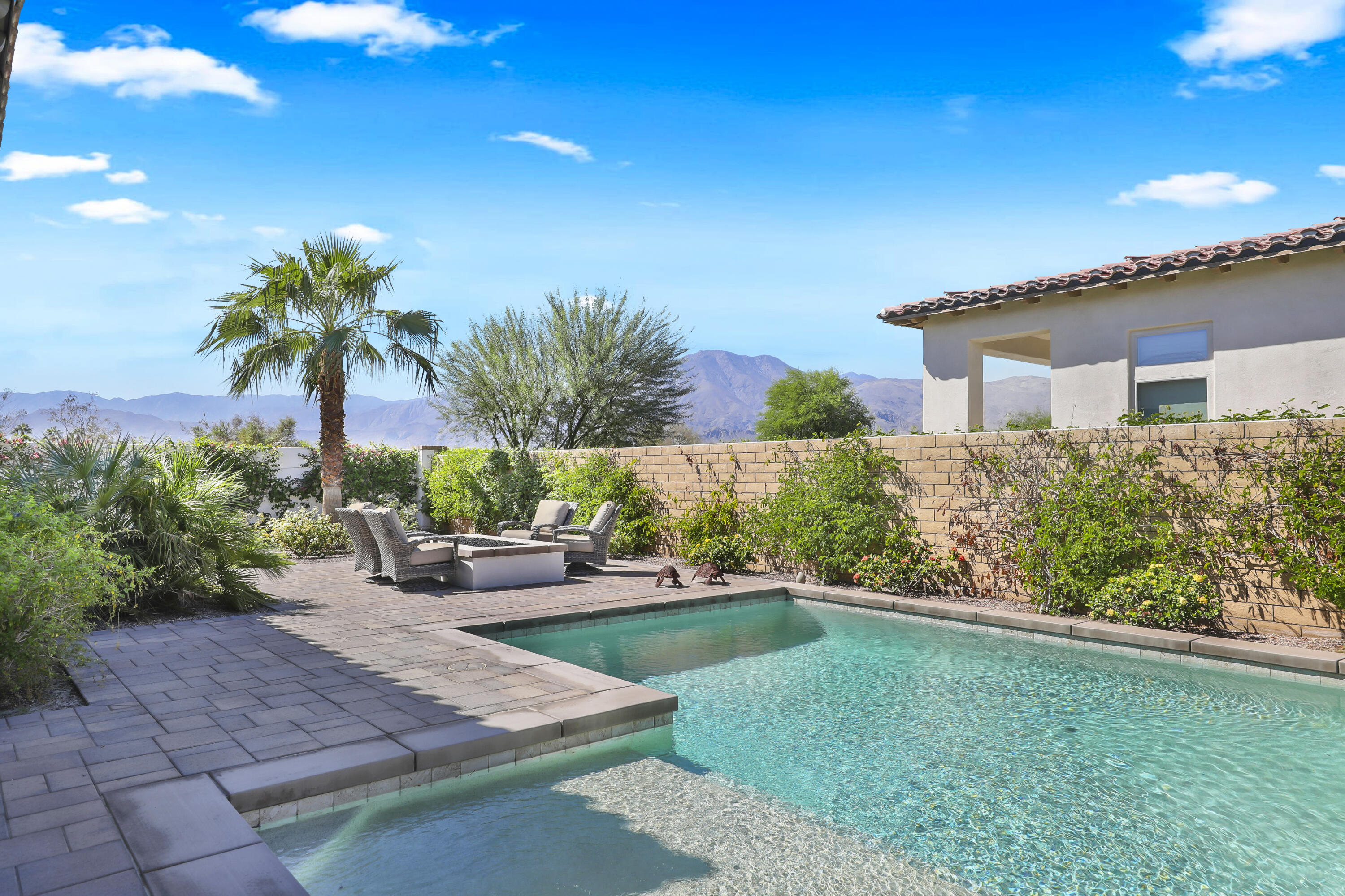 81-695 Thunder Gulch Way La Quinta, CA 92253 - Photo 32 of 51 a house view with a garden space