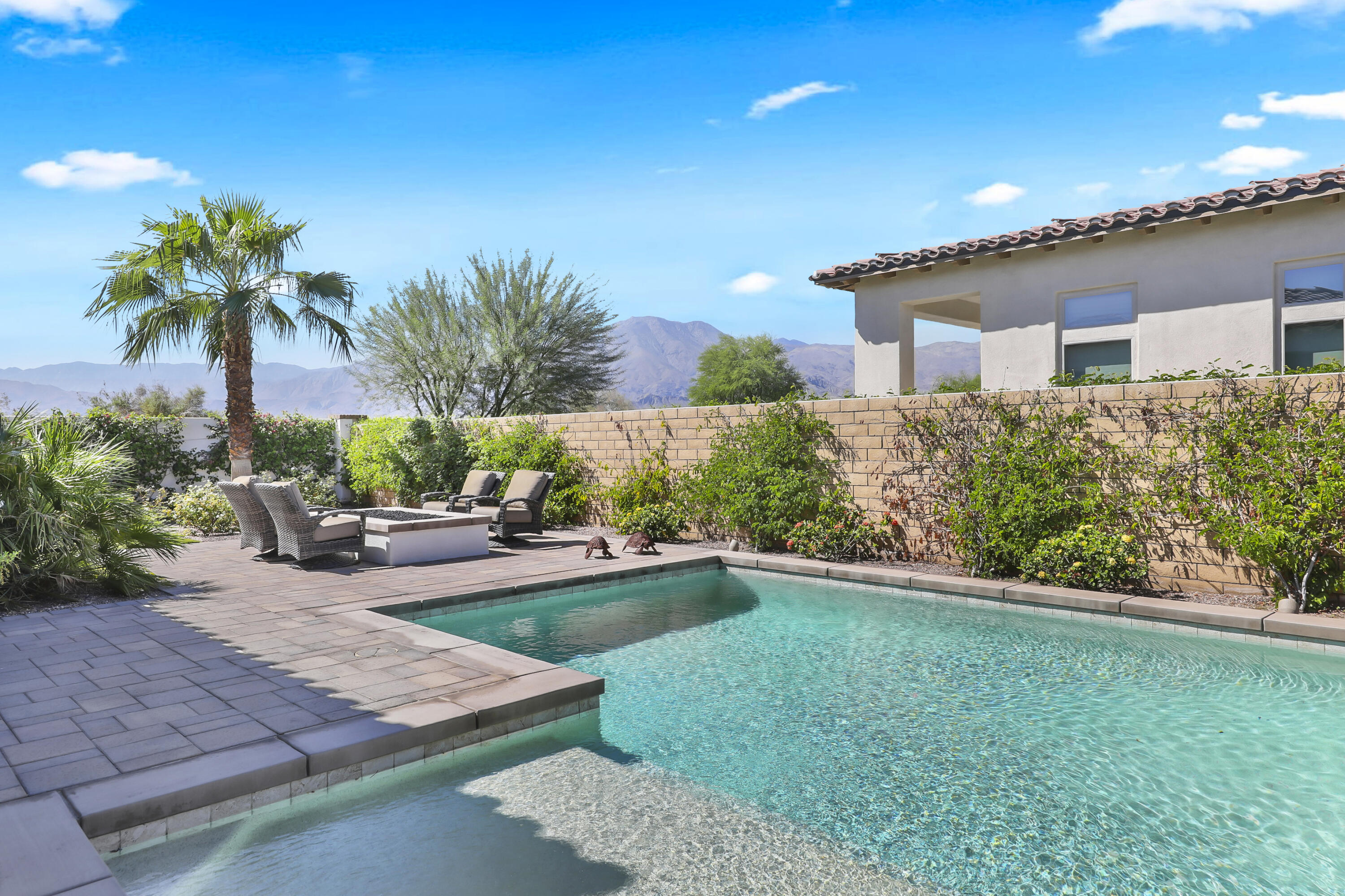 81-695 Thunder Gulch Way La Quinta, CA 92253 - Photo 34 of 51 a view of a backyard with plants and a patio