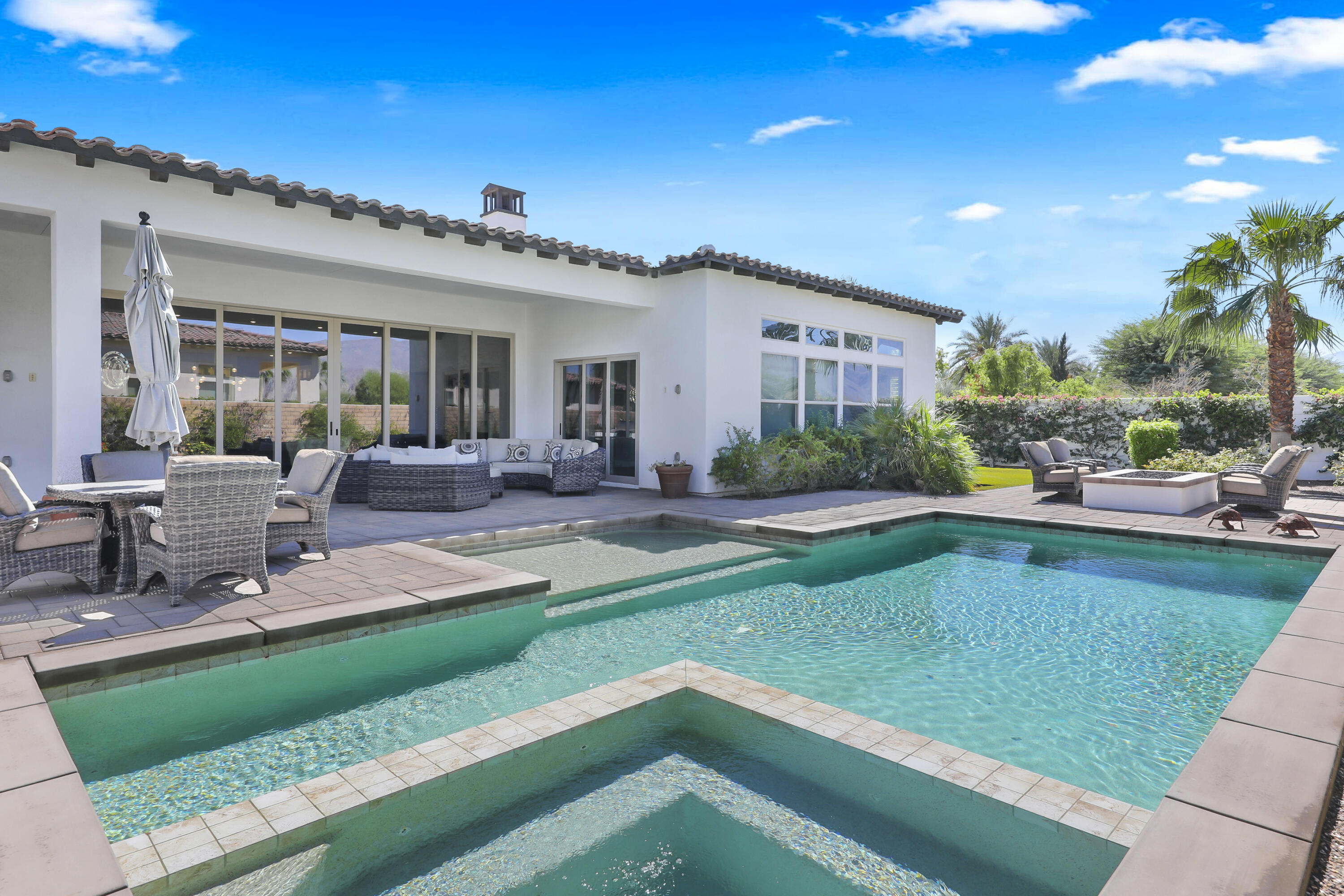 81-695 Thunder Gulch Way La Quinta, CA 92253 - Photo 37 of 51 a view of a house with a yard patio and fire pit