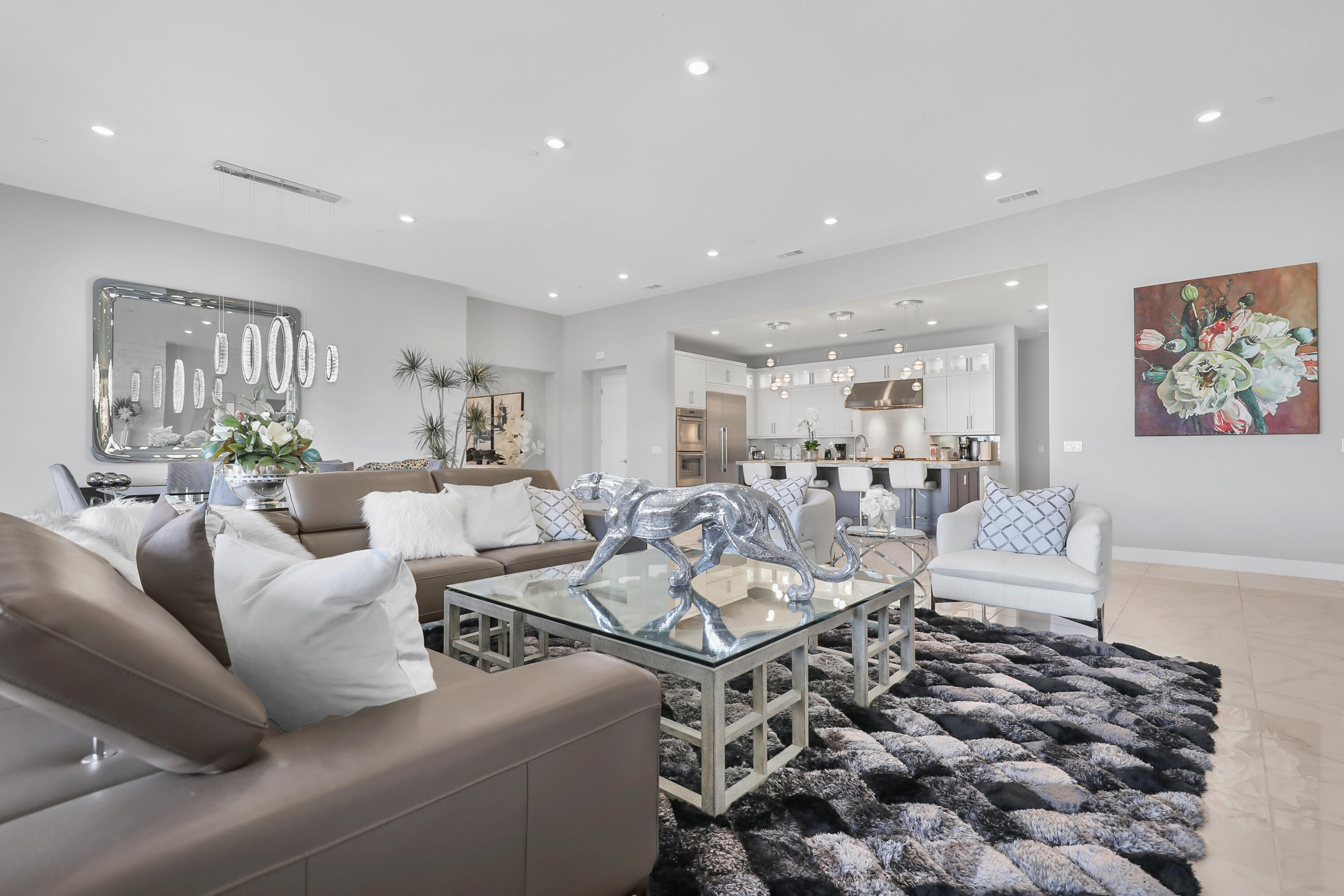 81-695 Thunder Gulch Way La Quinta, CA 92253 - Photo 6 of 51 a living room with furniture a rug and white walls