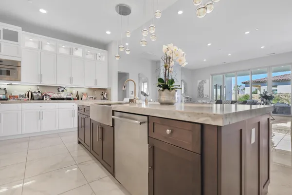 a bathroom with a glass door shower and a sink
