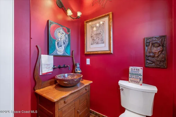 a large kitchen with stainless steel appliances granite countertop a stove and a large cabinets