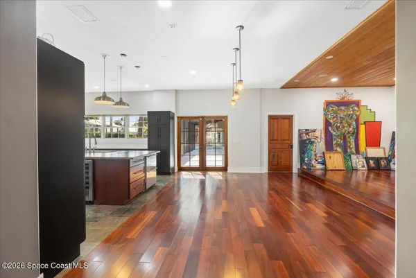 a view of an entryway with wooden floor