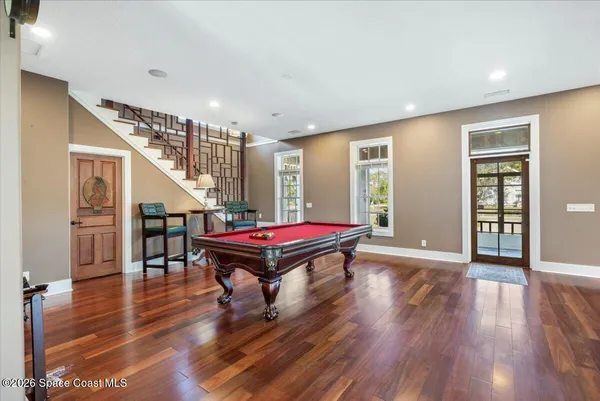 a view of a living room and entry way to kitchen