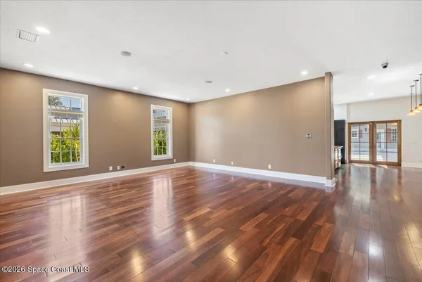 a large kitchen with stainless steel appliances a large counter top