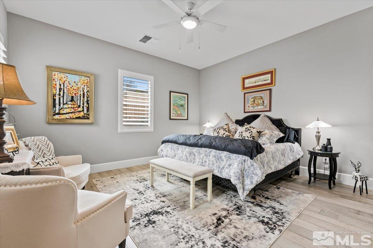 2166 Kate's Bridge Drive Reno, NV 89521 - Photo 15 of 34 a bedroom with a bed and wooden floor