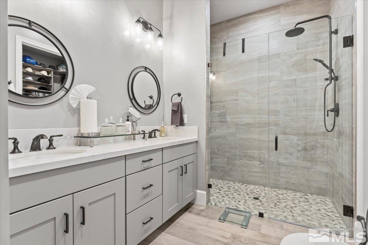 2166 Kate's Bridge Drive Reno, NV 89521 - Photo 17 of 34 a bathroom with a double vanity sink mirror and shower