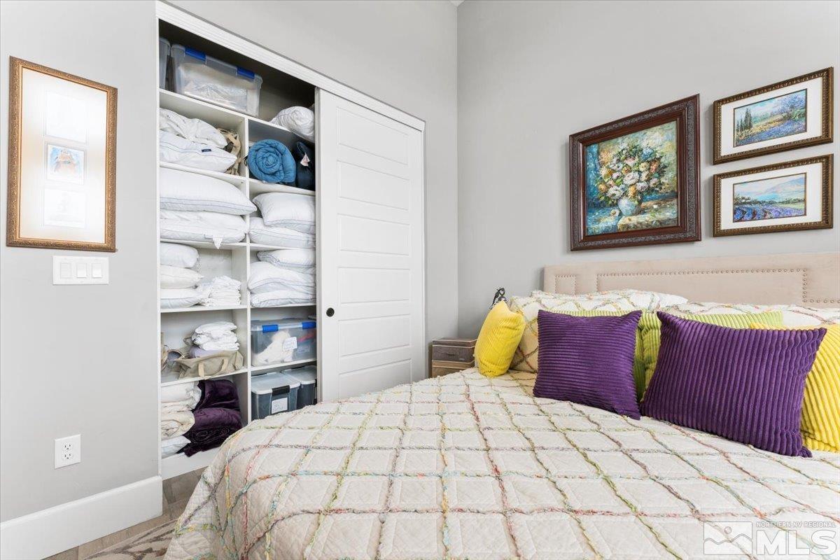 2166 Kate's Bridge Drive Reno, NV 89521 - Photo 19 of 34 a bedroom with a large bed and a window